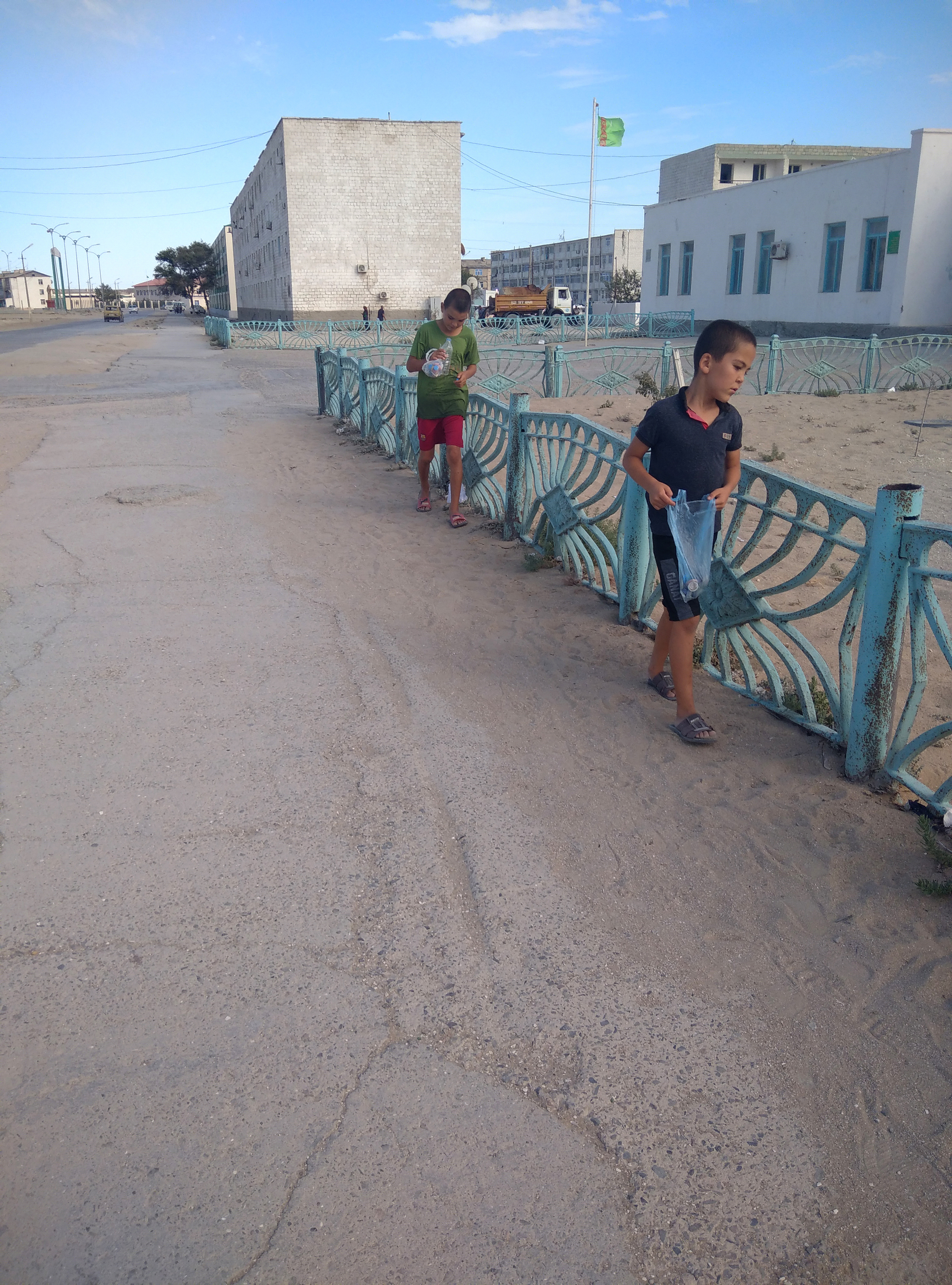 boys_collecting_caps_of_plastic_bottles_for_sale-1642608737